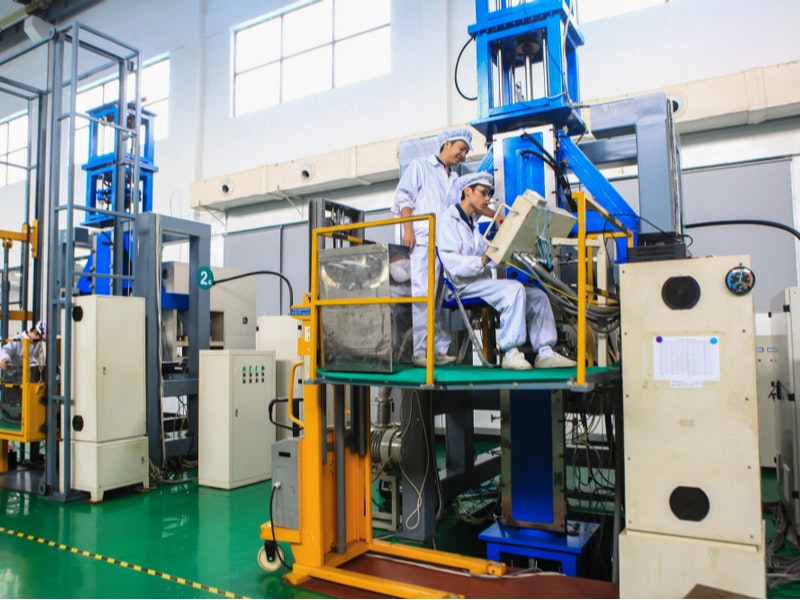 An engineer in Jiangxi, China, produces monocrystalline silicon for photovoltaic products. Courtesy of humphery/Shutterestock.com