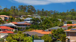 Solar panel on home in Australian suburban neighborhood. Credit zstock/Shutterstock.com