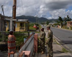 USACE Task Force Power Restoration Commander Col. John P. Lloyd, along with Capt. Aaron Anderson, TF Power operations officer, ask a resident in Maunabo, Puerto Rico, on Jan. 3, if she has power. Her reply: “Yes, and thank you, thank you so much,” Lloyd said. “Microgrids are a great tool to help us service areas where main grid restoration is not projected to be complete in the near term,” said Lloyd. “Microgrids allow us to proof a distribution system in an area prior to main grid restoration so that when grid power is restored, there is less time spent having to diagnose the lines. The system is also very versatile, and may be a capability that can be used in future storms throughout the region.” USACE Task Force Power Restoration Commander Col. John P. Lloyd, along with Capt. Aaron Anderson, TF Power operations officer, ask a resident in Maunabo, Puerto Rico, on Jan. 3, if she has power. Her reply: “Yes, and thank you, thank you so much,” Lloyd said. “Microgrids are a great tool to help us service areas where main grid restoration is not projected to be complete in the near term,” said Lloyd. “Microgrids allow us to proof a distribution system in an area prior to main grid restoration so that when grid power is restored, there is less time spent having to diagnose the lines. The system is also very versatile, and may be a capability that can be used in future storms throughout the region.”