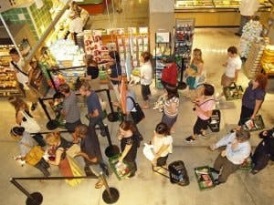 Waiting_in_line_at_a_food_store-300x225