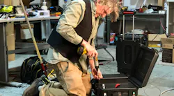 Eric Youngren, NUE vice president of product development, changes a unit to the Ukrainian voltage and frequency. Courtesy of Footprint Project