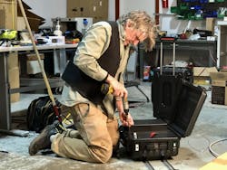 Eric Youngren, NUE vice president of product development, changes a unit to the Ukrainian voltage and frequency. Courtesy of Footprint Project Eric Youngren, NUE vice president of product development, changes a unit to the Ukrainian voltage and frequency. Courtesy of Footprint Project