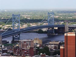 The Benjamin Franklin Bridge crosses the Delaware River connecting Philadelphia, Pennsylvania and Camden New Jersey. The suspension bridge has been in service since 1926. Credit Shutterstock.com The Benjamin Franklin Bridge crosses the Delaware River connecting Philadelphia, Pennsylvania and Camden New Jersey. The suspension bridge has been in service since 1926. Credit Shutterstock.com