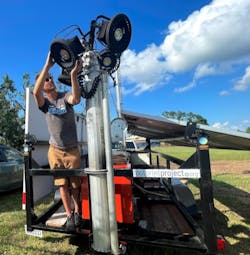 Will Heegaard adjusts security lighting at a volunteer camp in Houma, La. following Hurricane Ida. Will Heegaard adjusts security lighting at a volunteer camp in Houma, La. following Hurricane Ida.