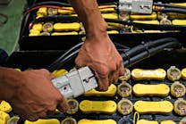 Battery being plugged in for an electric forklift. Photo by PS stock/Shutterstock.com