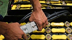 Battery being plugged in for an electric forklift. Photo by PS stock/Shutterstock.com