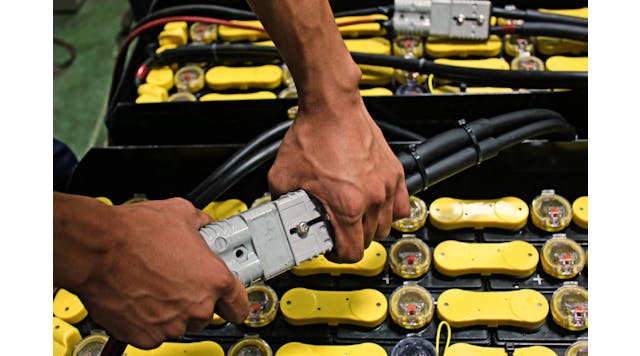 Battery being plugged in for an electric forklift. Photo by PS stock/Shutterstock.com