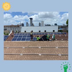 Louisiana Green Corps workers install solar panels at Grace at the Green Light, a nonprofit that helps feed the homeless.