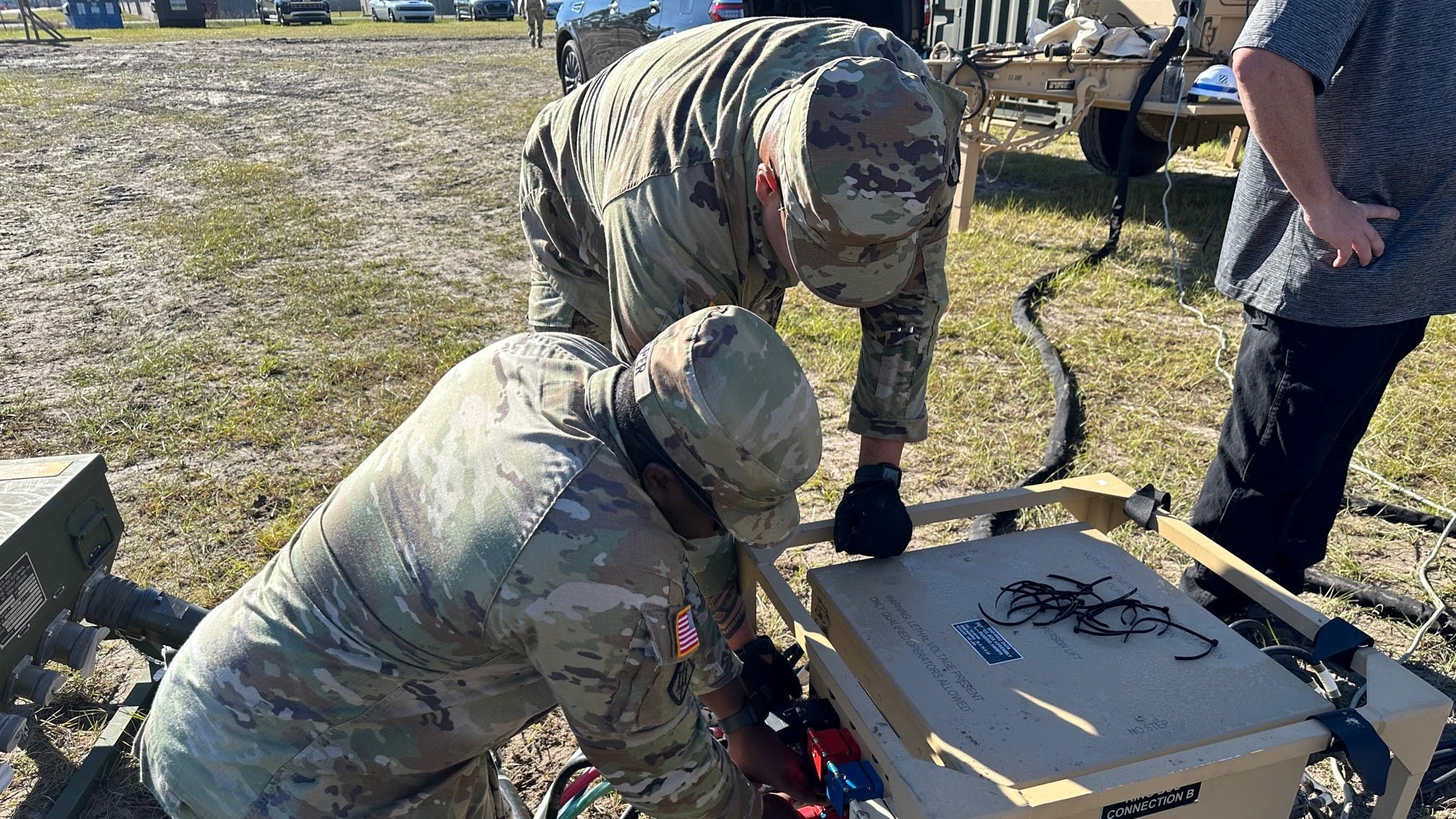 Soldiers from the 14th FH working on the Microgrid System setup and connections during an operational test conducted by the U.S. Army Test and Evaluation Activity at Fort Stewart, Georgia on Nov. 5, 2023. (Photo Credit: Jose Rodriguez, U.S. Army Medical Center of Excellence)