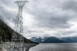 Electricity power lines running along rural Turnagain Arm Near Anchorage, AK. (Brandon Olafsson / Shutterstock.com)
