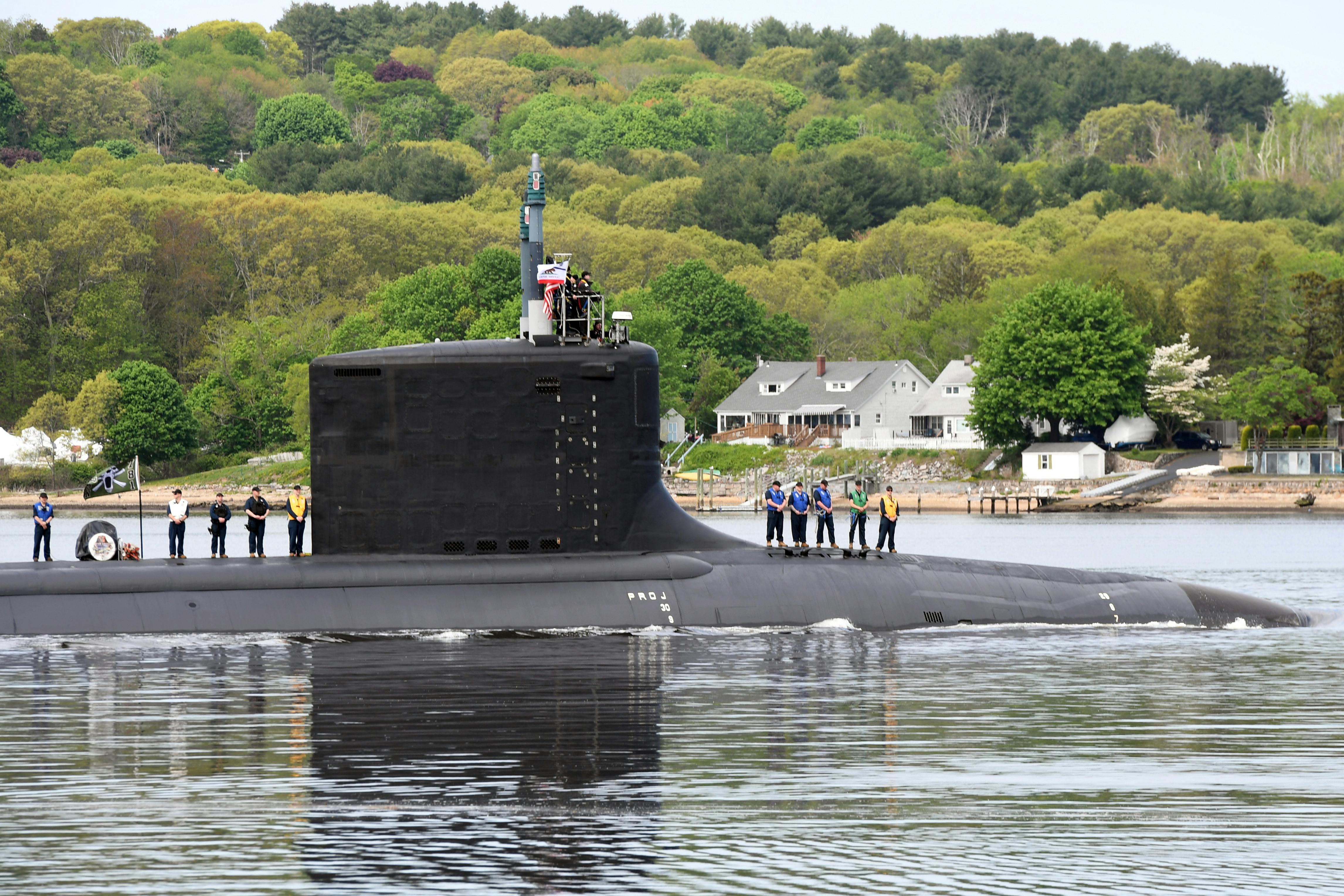 The Virginia-class attack submarine USS California (SSN 781) transits the Thames River during a change-of-command ceremony near Naval Submarine Base New London in Groton, Connecticut. (Source: U.S. Navy photo by Chief Petty Officer Joshua Karsten)