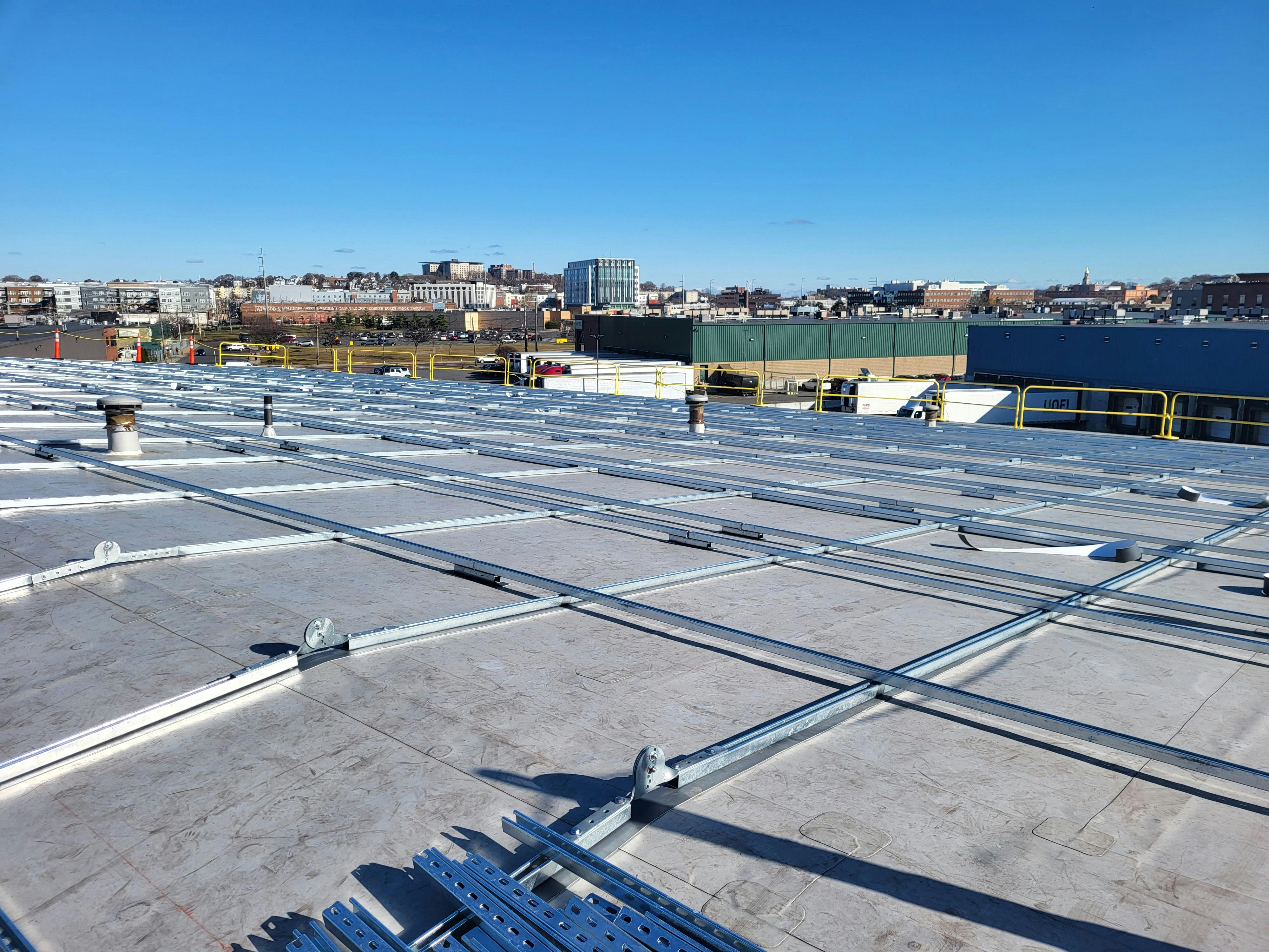 This photo shows progress made on installing solar panels on the roof of Chelsea's Municipal Public Works Building. Installation began Dec. 2. Image credit Green Roots