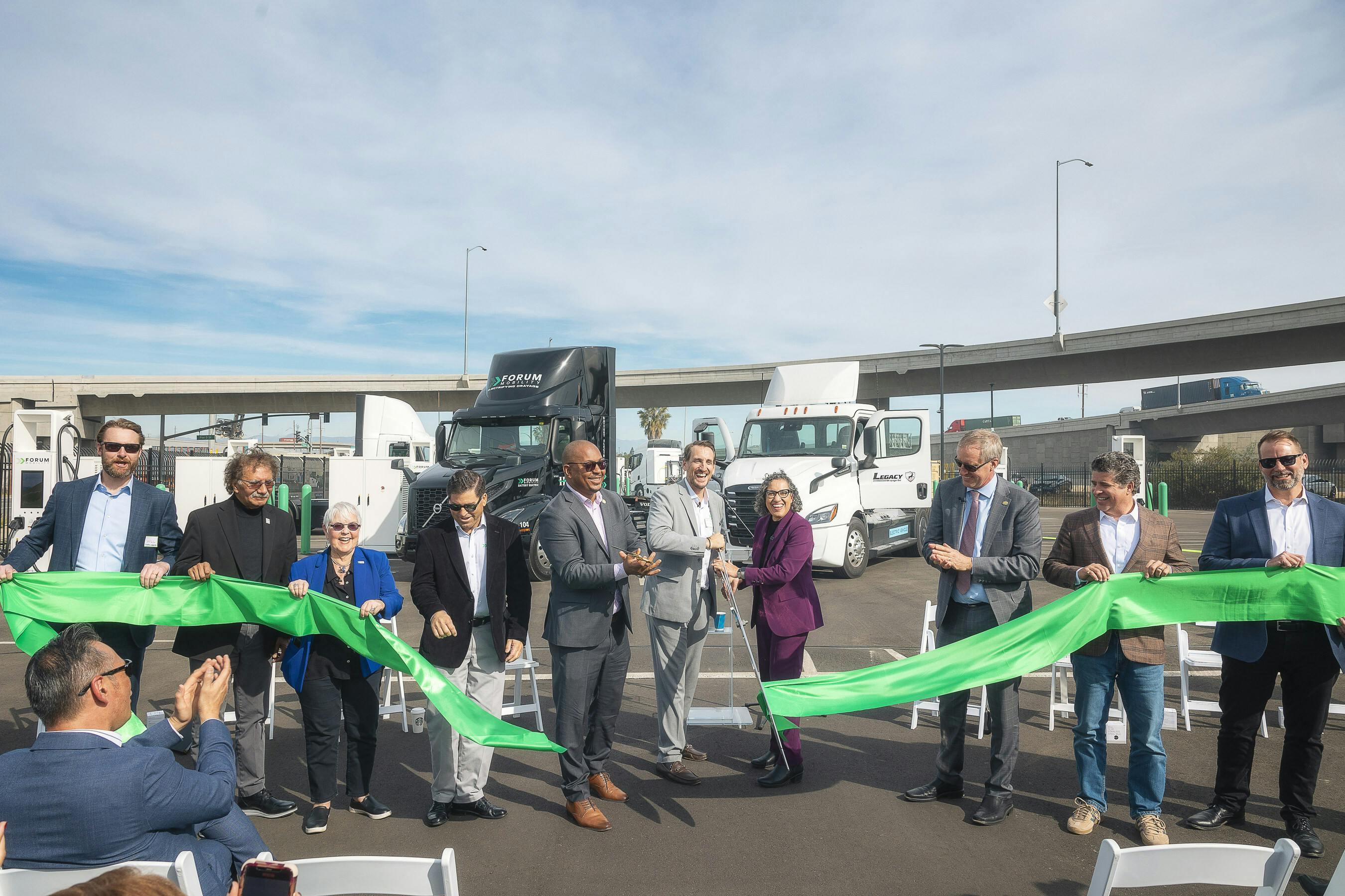 Ribbon cutting ceremony for the FM Harbor electric truck charging depot in the Port of Long Beach. With 9 MW of power and 44 high-speed charging dispensers, the depot provides reliable and convenient charging next to terminals for Forum Mobility customer fleets. (Source: Forum Mobility)