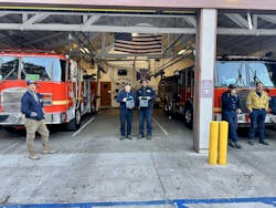 Topanga Station 49 firefighters holding solar-powered portable batteries. Image courtesy Footprint Project Topanga Station 49 firefighters holding solar-powered portable batteries. Image courtesy Footprint Project
