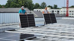 Solar installers wire-managing commercial panels on a self-storage facility in Virginia. Image credit Virtue Solar Solar installers wire-managing commercial panels on a self-storage facility in Virginia. Image credit Virtue Solar
