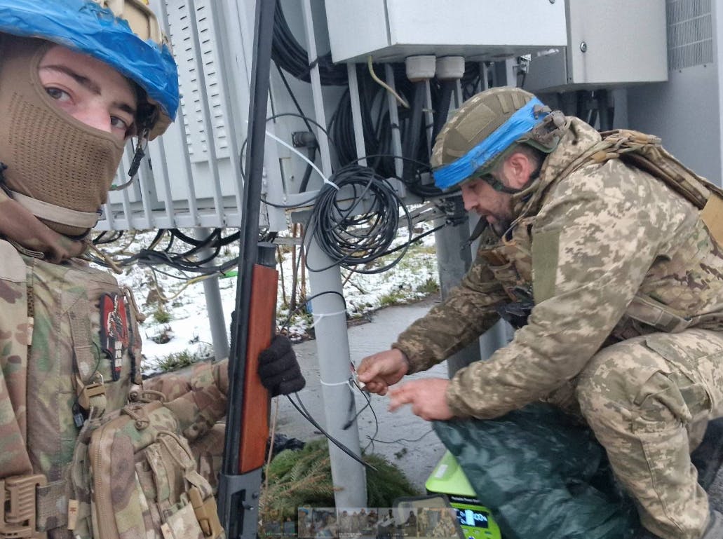 Ukraine soldiers power up anti-drone equipment. Image credit New Use Energy