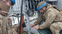 Ukraine soldiers power up anti-drone equipment. Image credit New Use Energy