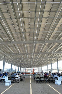Guests sit under one of many solar arrays that help make up the $21.8 million microgrid project at Fort Hunter Liggett during a ribbon cutting ceremony on Sept 17, 2024. (Photo by Joseph Bruton) Guests sit under one of many solar arrays that help make up the $21.8 million microgrid project at Fort Hunter Liggett during a ribbon cutting ceremony on Sept 17, 2024. (Photo by Joseph Bruton)
