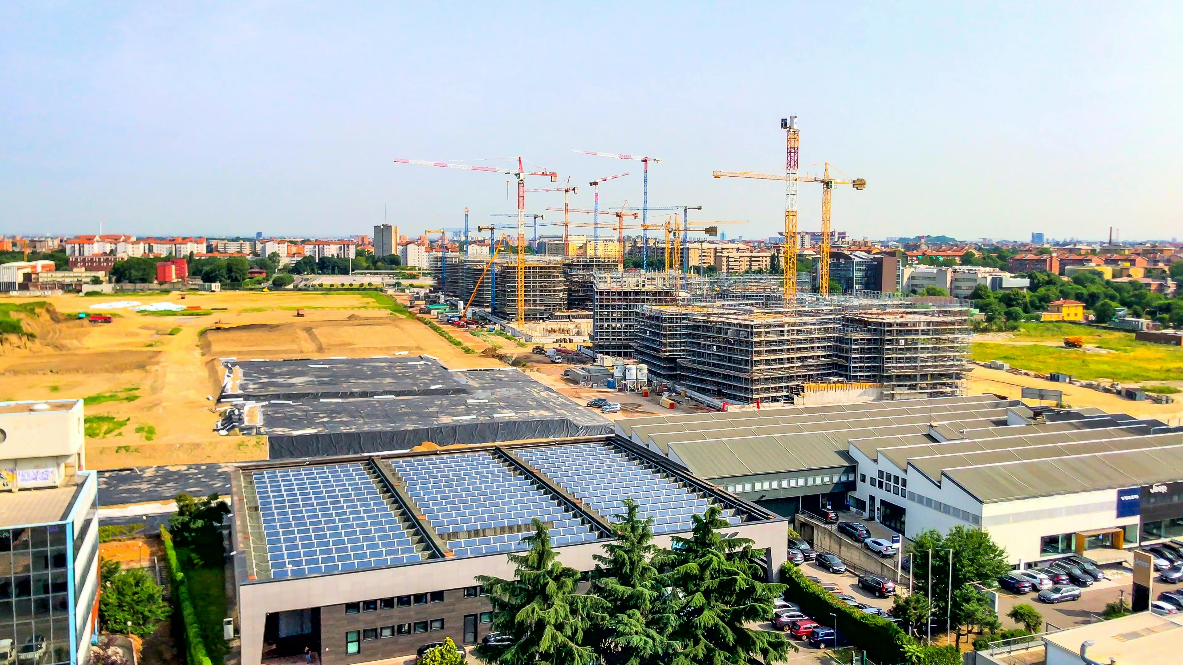 Shot of commercial real estate development with rooftop solar. Image credit VILTVART/Shutterstock.com