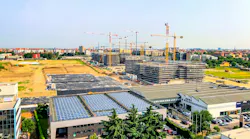 Shot of commercial real estate development with rooftop solar. Image credit VILTVART/Shutterstock.com