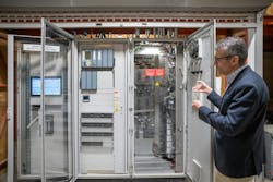 Dr. Ifran Al-Anbagi, director of the Microgrid Living Lab and associate professor in the Faculty of Engineering and Applied Science, stands in front of the microgrid's control center. (Photo by U of R Photography) Dr. Ifran Al-Anbagi, director of the Microgrid Living Lab and associate professor in the Faculty of Engineering and Applied Science, stands in front of the microgrid's control center. (Photo by U of R Photography)