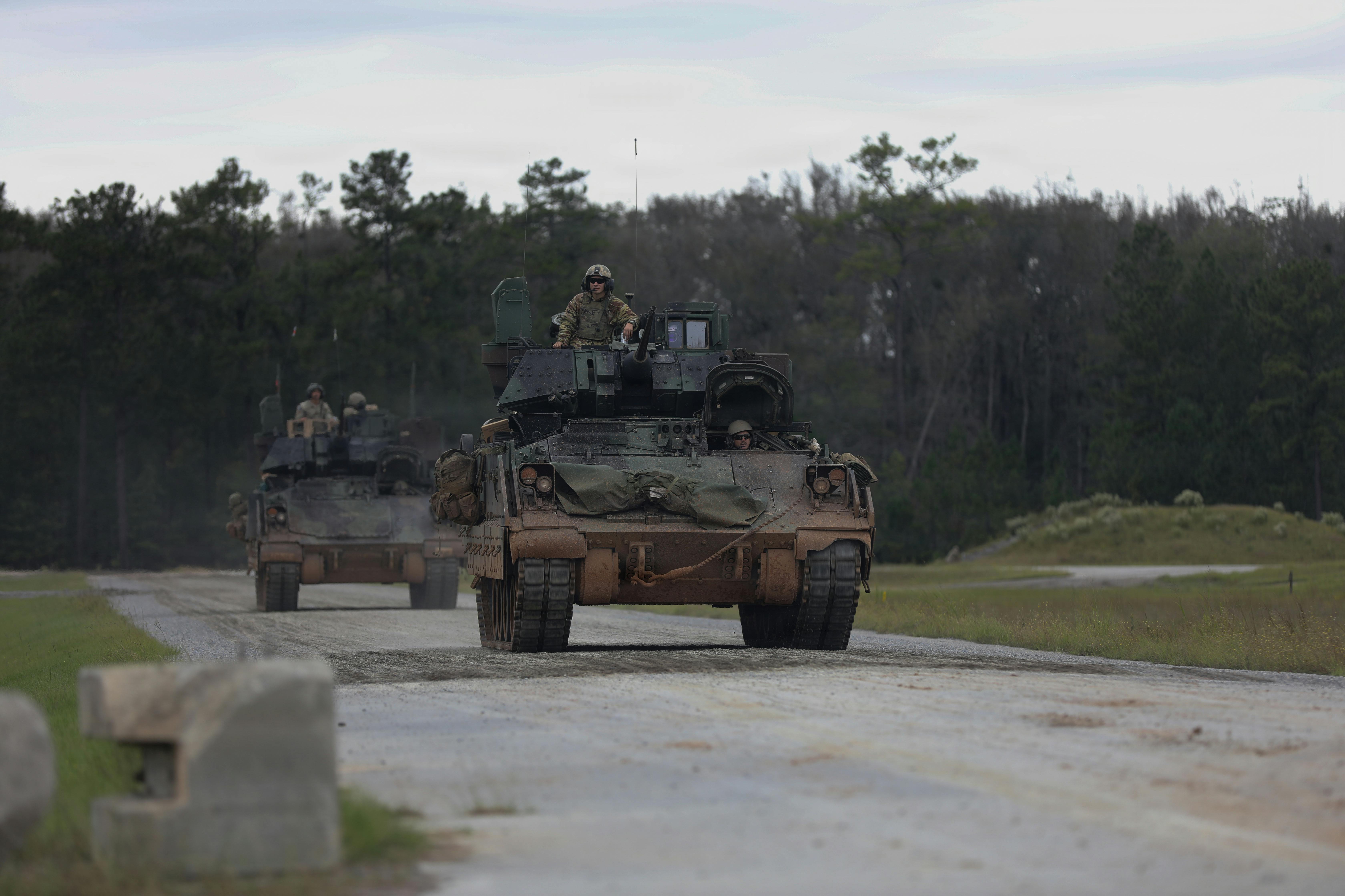 U.S. Soldiers, with 3rd Battalion, 67th Armor Regiment, 2nd Armored Brigade Combat Team, 3rd Infantry Division, move to firing positions in preparation for direct firing training during Spartan Density at Fort Stewart, Georgia, Oct. 9, 2025. (Source: U.S. Army photo by Spc. Darnell Howard)