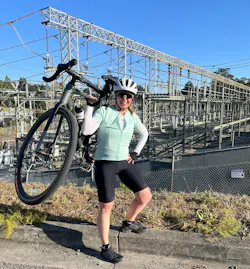 Power flex: the author with her bicycle in front of her local substation. Image credit Joanna Hamblin Power flex: the author with her bicycle in front of her local substation. Image credit Joanna Hamblin