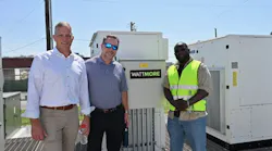 Eos Energy Enterprise Chief Commercial Officer Nathan Kroeker, left, stands in front of the new Lincoln Electric System (LES) battery storage project with WATTMORE CEO J.W. Postal and EOS senior technician Dallas Davidson. Image credit Eos and WATTMORE